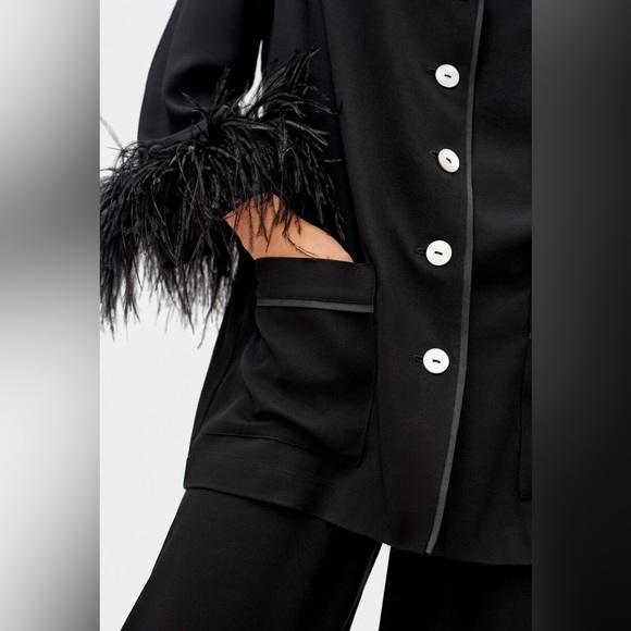 BNWT Sleeper feather pyjamas with feathers!! XL, black. - Picture 2 of 4